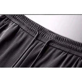 Jogging en maille respirante et élastique pour Homme